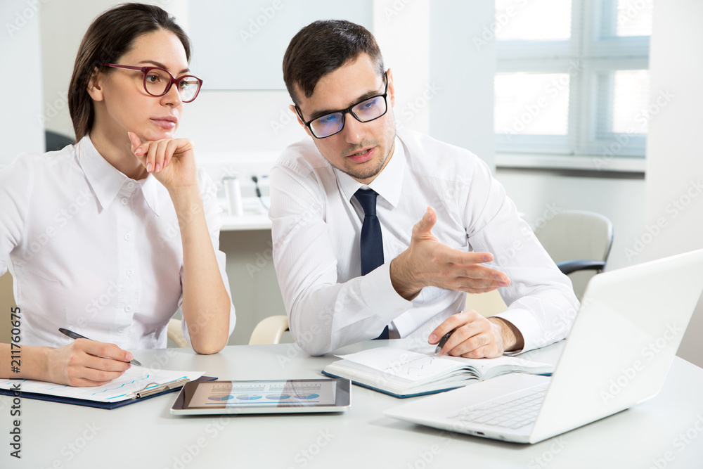 Businessman explains to colleague a new project Businessman explains to colleague a new project