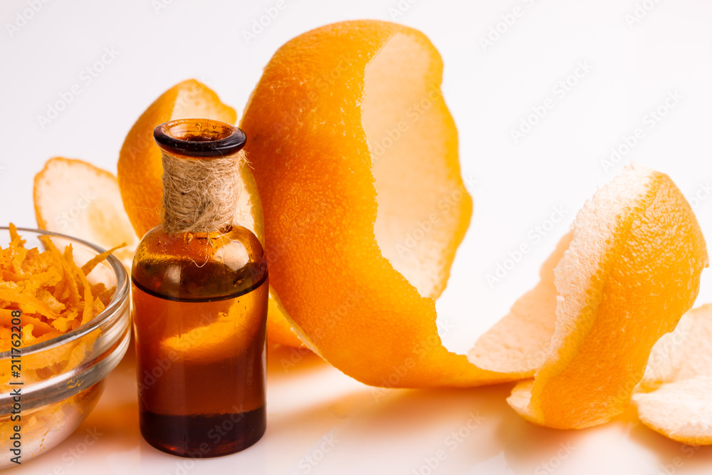 orange essential oil on a white background
