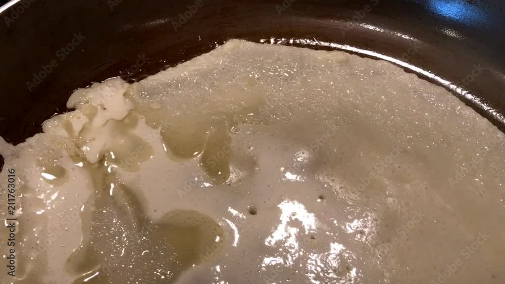 Close up shot of Pancake dough on a frying pan Close up shot of Pancake dough on a frying pan