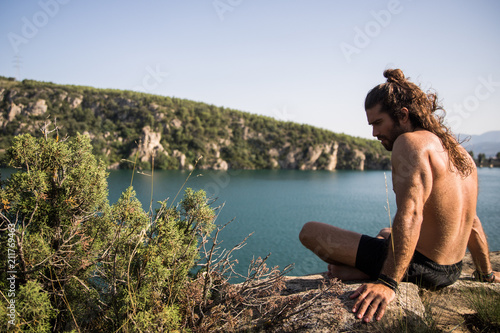 Man sitting on a cliff