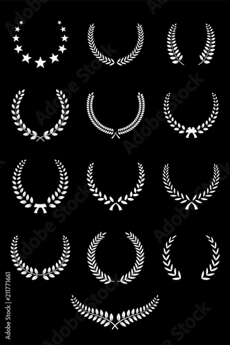 Set of white laurel wreaths isolated on black background. Vector design elements.