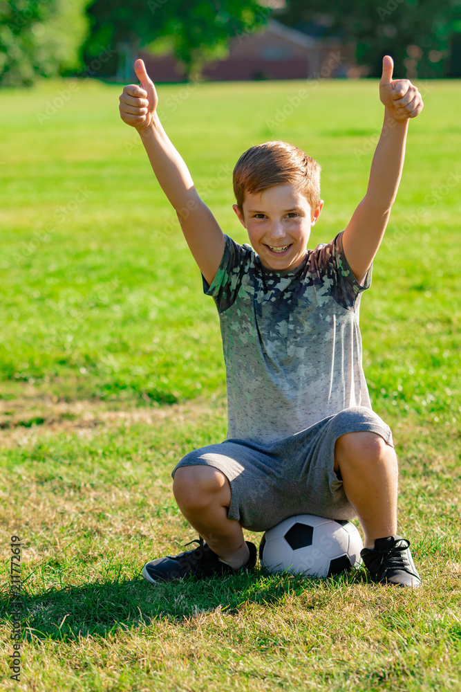 Obraz premium Pre-teen caucasian boy playing outside