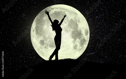 Fotografie woman raising arms in the moonlight. Have a positive mindset.