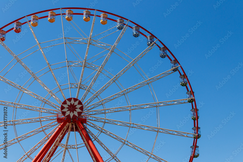 Ferris wheel on background of blue sky in Gorky Park. Kharkov, Ukraine