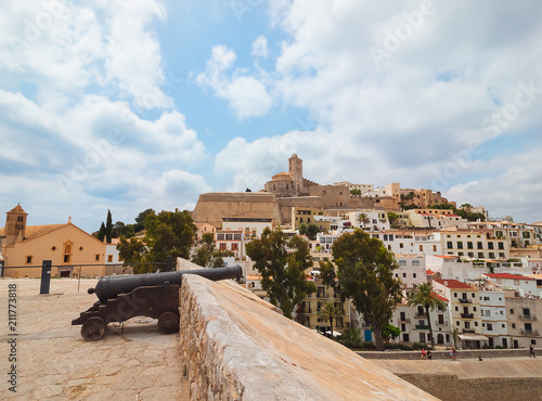 View of the fortified ancient city of Dalt Vila, in Ibiza, Spain. Typical white houses of the island, its wall and Cathedral of Santa María.