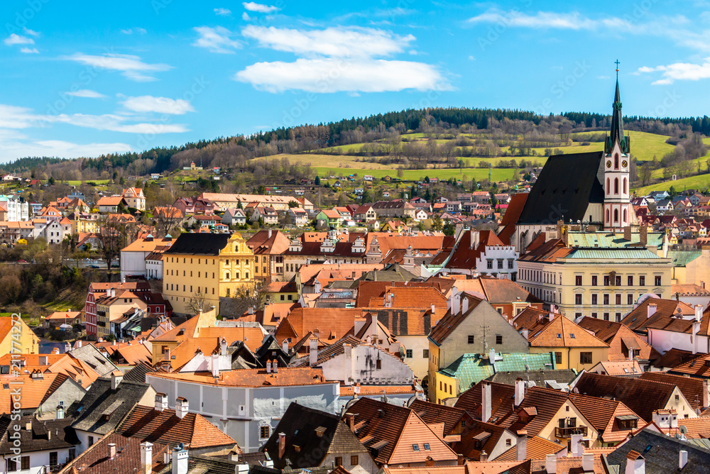 Cesky Krumlov. Beautiful aerial view at red roofs of the old town center and St Vitus Church. Landmarks of Bohemia, Czech republic
