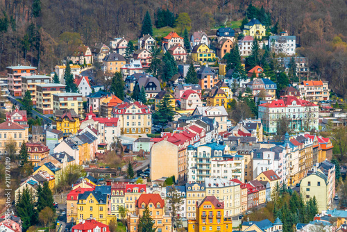 Fotografie, Tablou Beautiful color houses in city center of Karlovy Vary near Tepla river