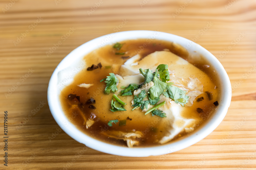 Jellied bean curd and cilantro leaves. Tofu pudding. Unique Traditional Chinese Foods Jellied bean curd and cilantro leaves. Tofu pudding. Unique Traditional Chinese Foods