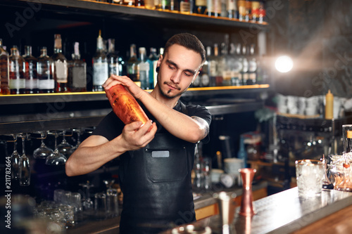 Bartender Shaking Cocktail Shaker Making Cocktails At Bar