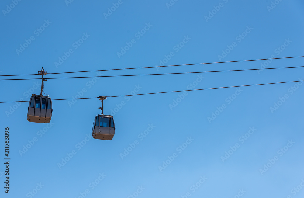 cableway against the sky, transport at height and tourist attraction