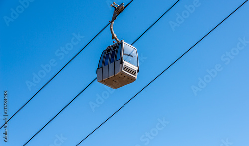 cableway against the sky, transport at height and tourist attraction