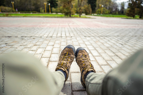 Hiking shoes on city background