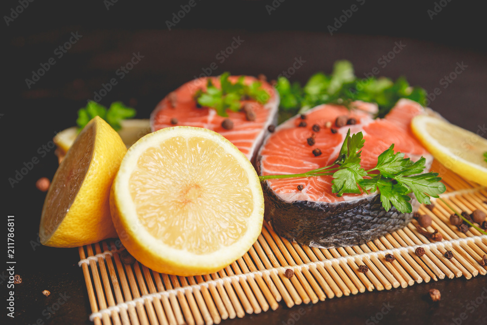 Salmon steaks with lemon and spices close up view. Salmon steaks with lemon and spices close up view.