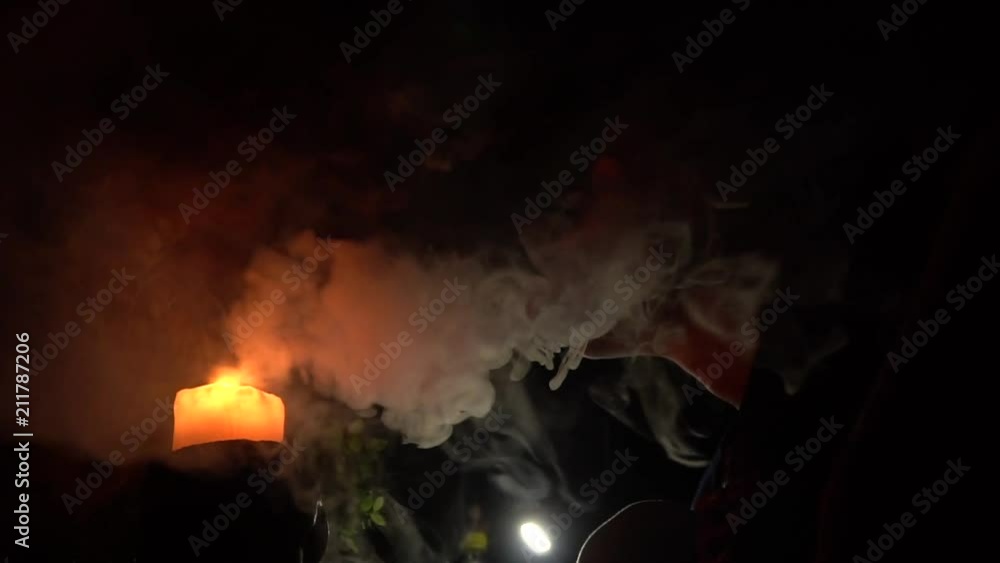 Smoke from candles on a black background in forest Smoke from candles on a black background in forest