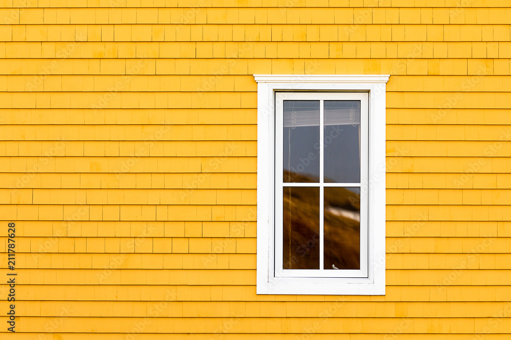 White window on yellow tiled wall White window on yellow tiled wall