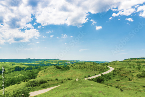 Green hills and empty road