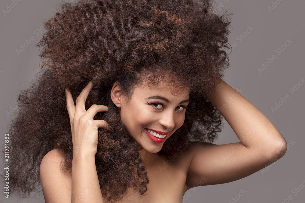 Beauty portrait of attractive woman in afro hairstyle. Beauty portrait of attractive woman in afro hairstyle.