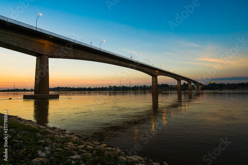 Thai-Laos Friendship Bridge on sunset background © songdech17