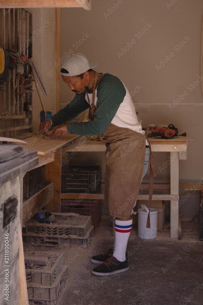 Man making skateboard Man making skateboard
