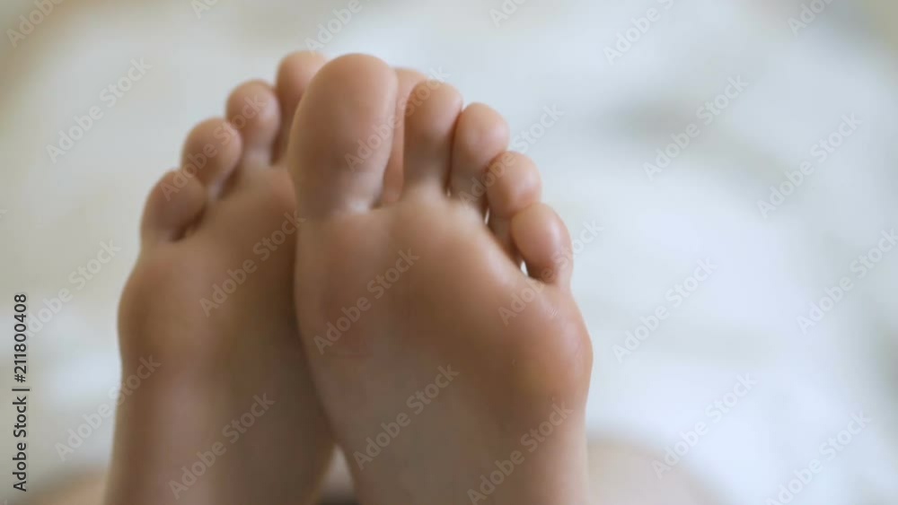 Movement of toes, attractive girl in bed Movement of toes, attractive girl in bed