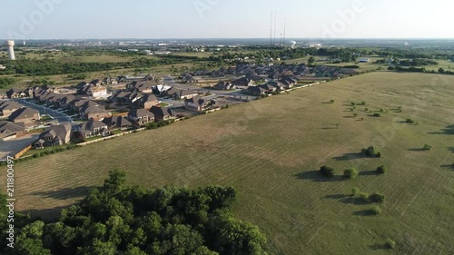 Aeriel Shot of a few houses with a fly in manuver. photo