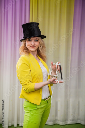 Woman magician shows tricks photo