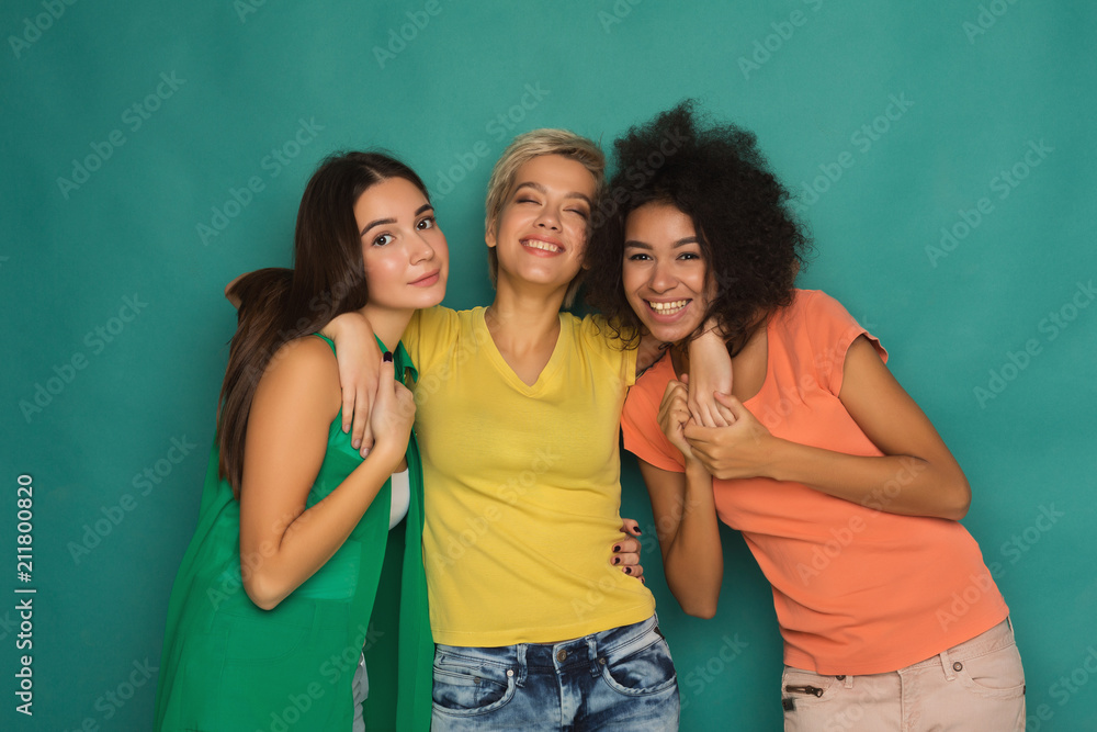 Happy friends having fun at blue background Happy friends having fun at blue background