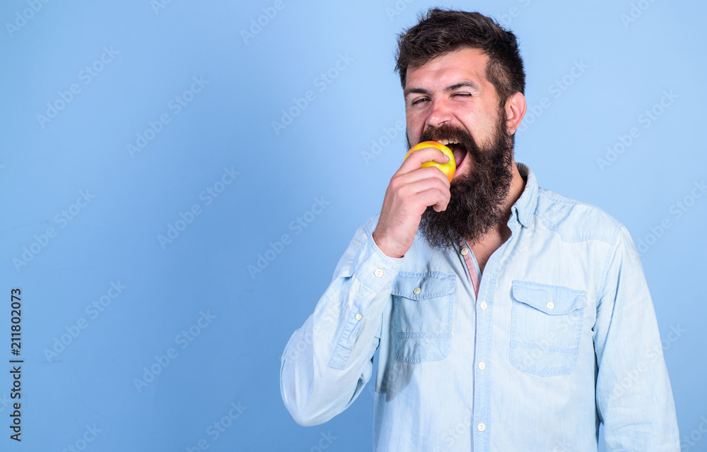 Apples popular fruit in world. Eat healthy. Eat apple can help lower blood sugar levels and protect against diabetes. Man with beard hipster hold apple fruit hand. Nutrition facts and health benefits Apples popular fruit in world. Eat healthy. Eat apple can help lower blood sugar levels and protect against diabetes. Man with beard hipster hold apple fruit hand. Nutrition facts and health benefits
