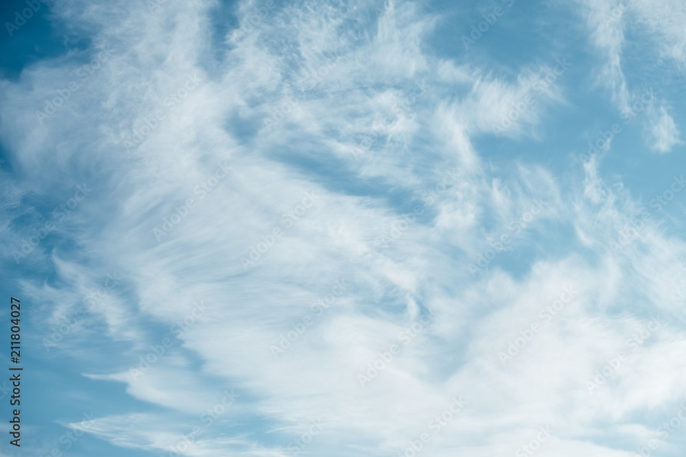 White fluffy clouds in the blue sky White fluffy clouds in the blue sky