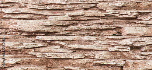 texture and structure of stone, tile, brown wall of blocks of decorative stone