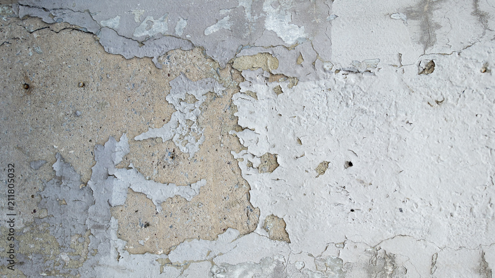 stucco painted white wall textured urban city wall chipped and peeling paint 