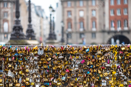 Love padlocks at Pont de l'Archeveche in Paris. The thousands of locks of loving couples symbolize love forever.