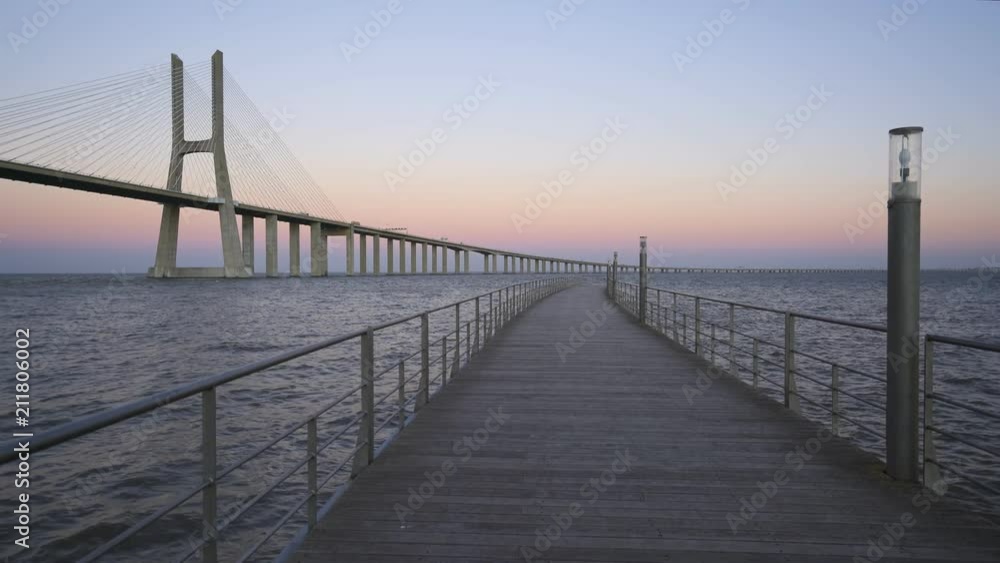 Ponte Vasco da Gama Bridge view from a pier at sunset Ponte Vasco da Gama Bridge view from a pier at sunset