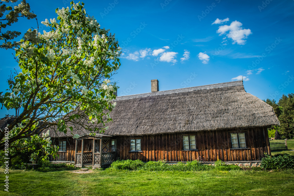 Old house in forest. Open-air ethnography museum near Riga, Latvia.
