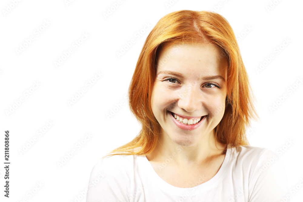 Beautiful redheaded young woman with satisfied facial expression, isolated on white background. Attractive female with natural red hair & brown eyes showing sincere smile & perfect teeth. Copy space. Beautiful redheaded young woman with satisfied facial expression, isolated on white background. Attractive female with natural red hair & brown eyes showing sincere smile & perfect teeth. Copy space.
