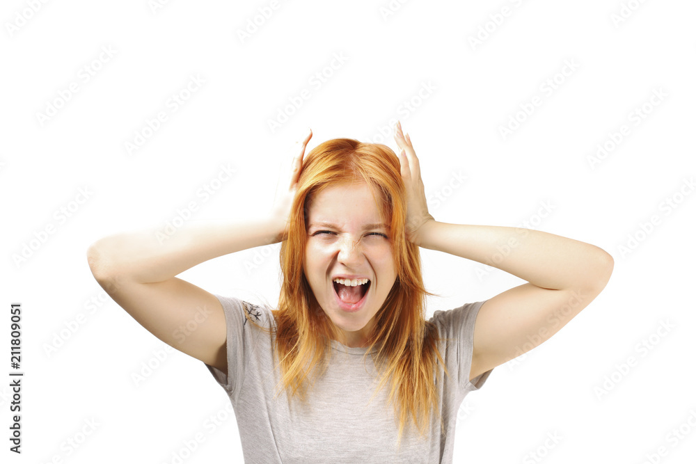 Beautiful redheaded young woman experiencing severe migraine writhing with pain. Pretty female feeling headache holding head. Nonverbal behavior, body language. White background, close up, copy space. Beautiful redheaded young woman experiencing severe migraine writhing with pain. Pretty female feeling headache holding head. Nonverbal behavior, body language. White background, close up, copy space.