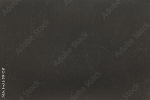 Textured scratched dark black surface background