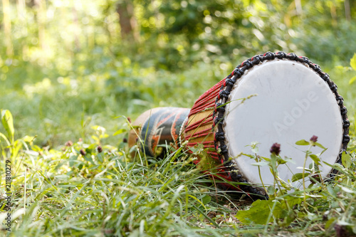 african djembe drum on the grass. close-up african musical drum instrument