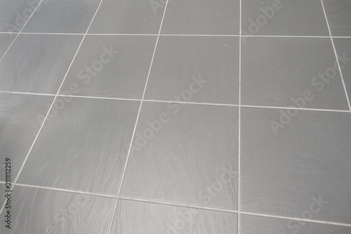 grey textured slate rock big tile flooring with white grey cemenet grout