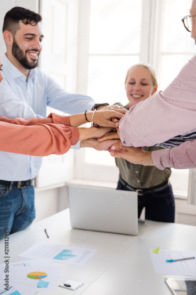 Fototapeta premium Business team celebrating a win in an office