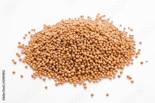 fragrant grains of mustard on a white background