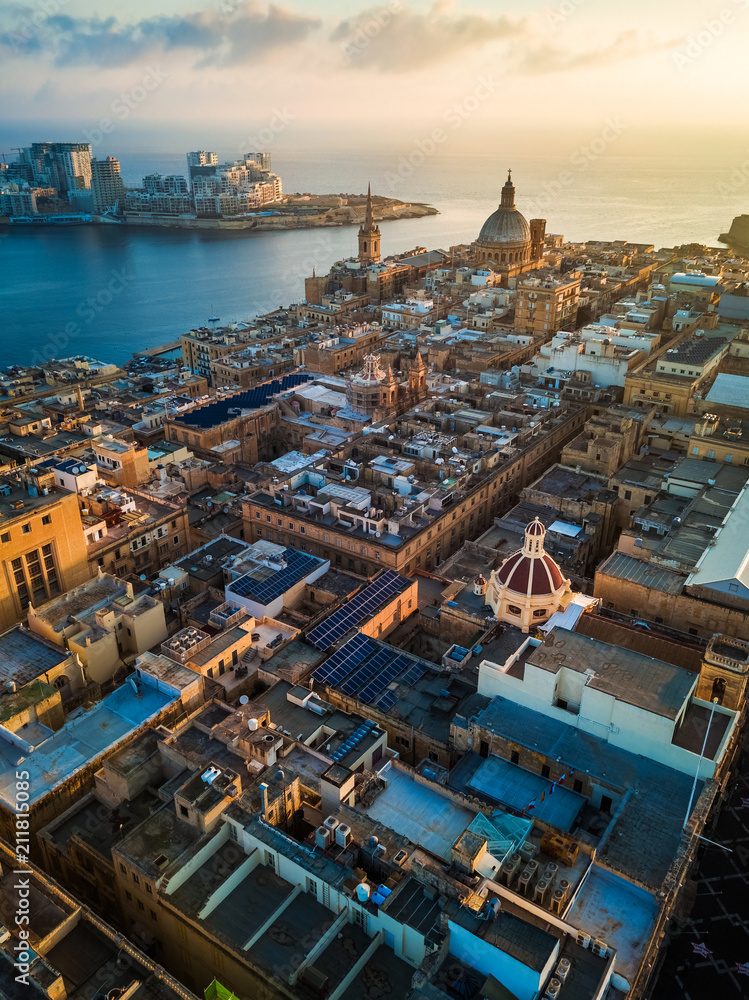 Valletta, Malta - Sunrise above Valletta with Our Lady of Mount Carmel church and St.Paul's Cathedral with Sliema at background - obrazy, fototapety, plakaty 