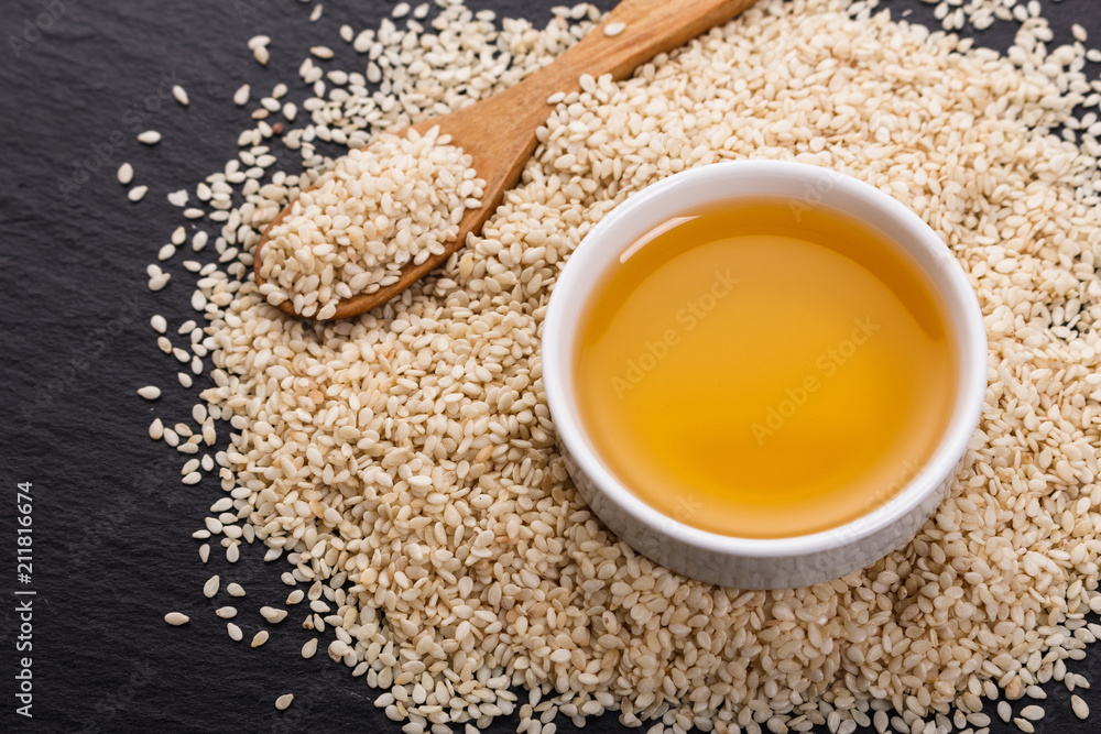 fresh sesame seeds on a rustic background fresh sesame seeds on a rustic background