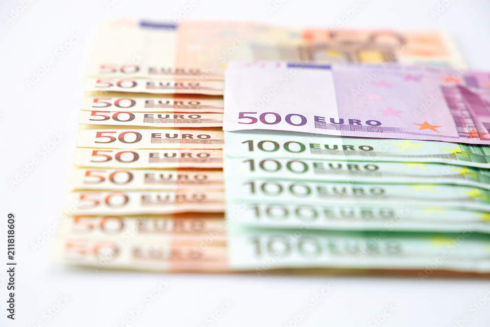 Euro banknotes close up. Several hundred euro banknotes on white background Euro banknotes close up. Several hundred euro banknotes on white background
