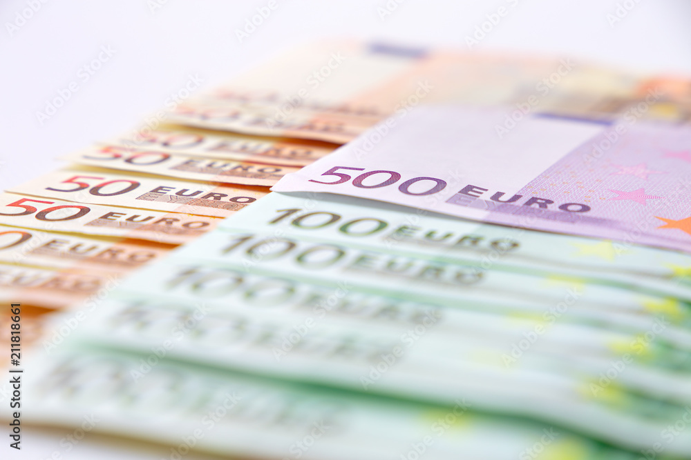 Euro banknotes close up. Several hundred euro banknotes on white background Euro banknotes close up. Several hundred euro banknotes on white background