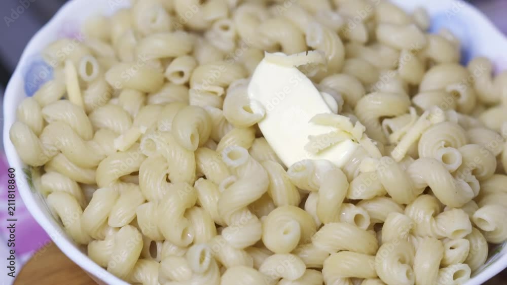 Pasta in bowl with butter and cheese Pasta in bowl with butter and cheese