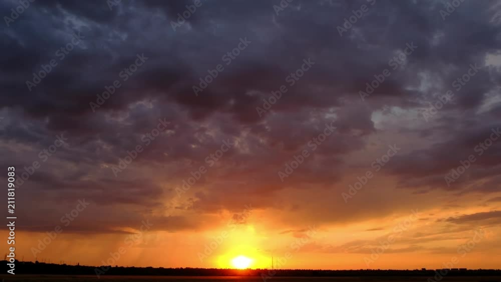 A view of sunset in the sky full of clouds