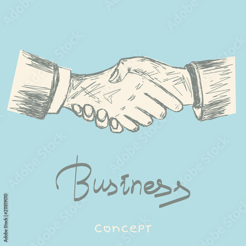 Handshaking of two businessmen meaning successful meeting or deal.