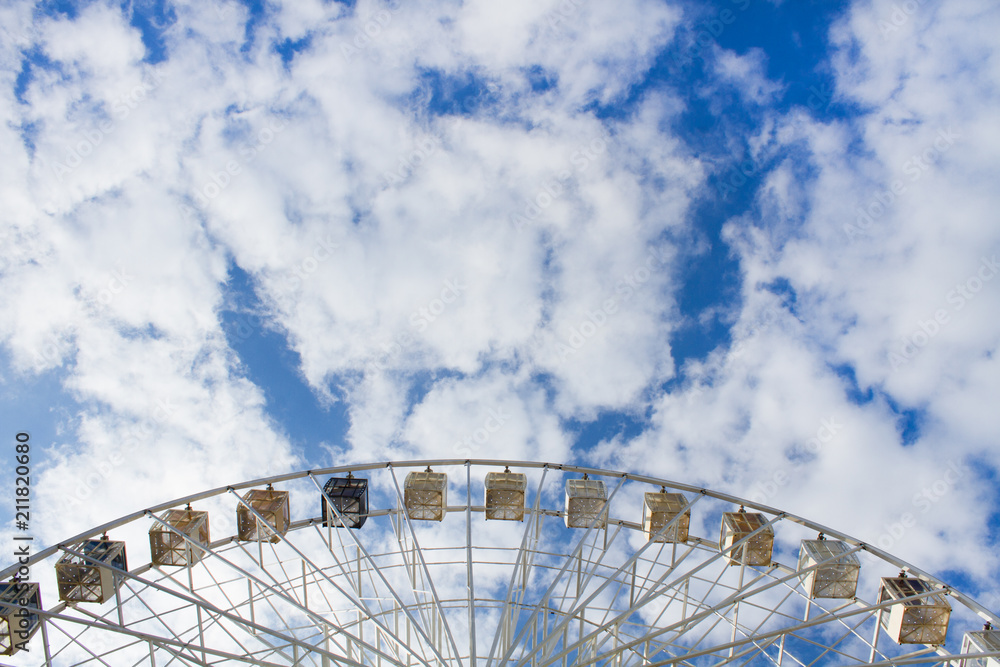 Ferris Wheel Over Blue Sky. Ferris wheel joy sky clouds. Summer