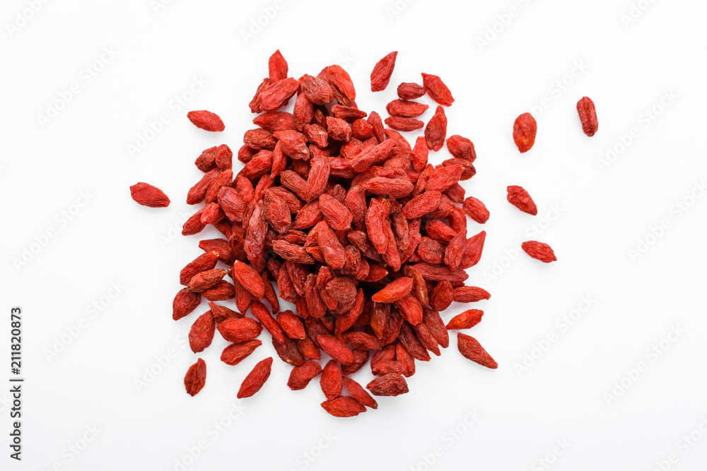 dried goji berries on a white acrylic background dried goji berries on a white acrylic background